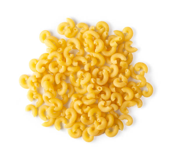 istock macaroni pasta close up  isolated on white background. top view 1215818300
