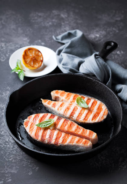 istock Grilled salmon steaks in cast iron pan 1215819786