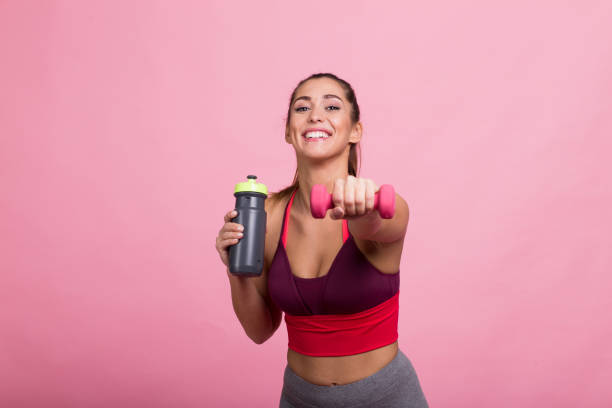 istock Charismatic lady exercising with the weights 1215820674