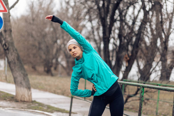istock Fit woman stretching in the public 1215820728
