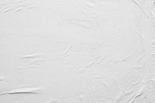 istock Blank white crumpled and creased paper poster texture background 1215820866