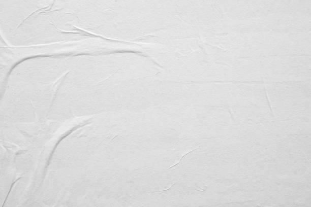 istock Blank white crumpled and creased paper poster texture background 1215820913