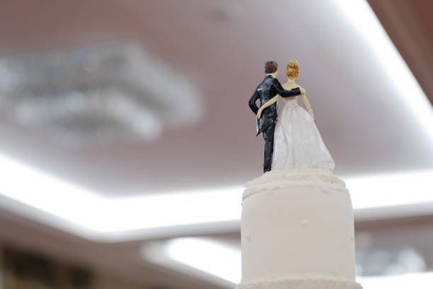 istock wedding doll on cake, love couple, happy concept 1215823278