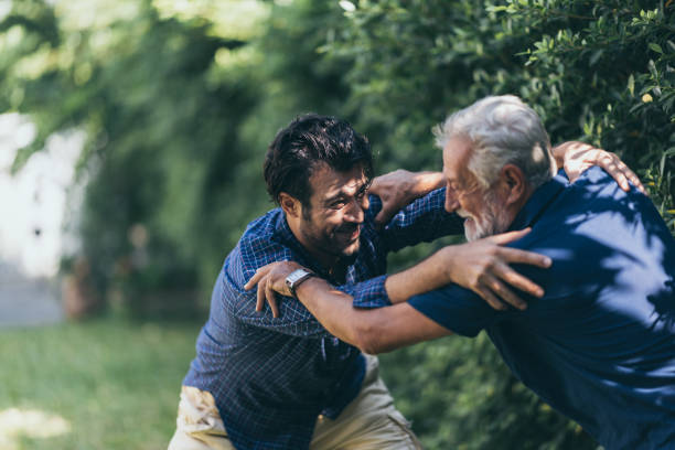 istock Hipster son with his senior father at home. 1215832199