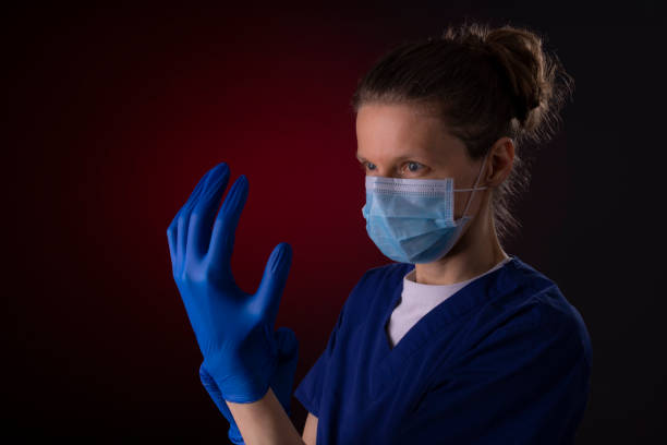 istock COVID-19 healthcare worker using PPE protective equipment 1215832508