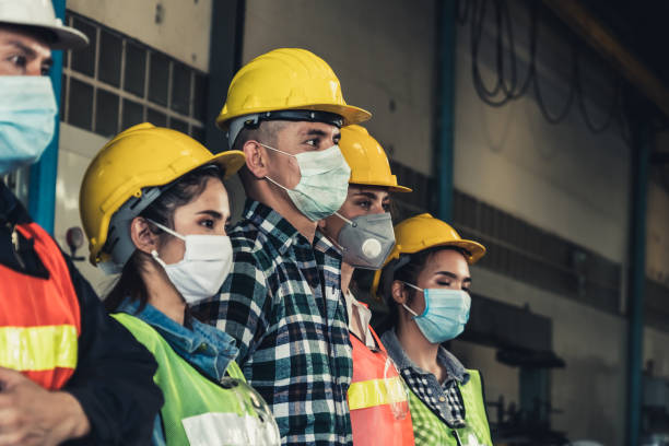istock Workers with face mask protect from outbreak of Corona Virus Disease 2019. 1215837560