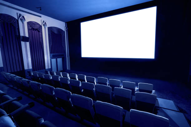 istock Cinema theater showing empty white movie screen. 1215837602