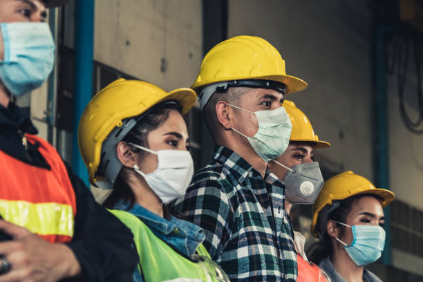 istock Workers with face mask protect from outbreak of Corona Virus Disease 2019. 1215837705