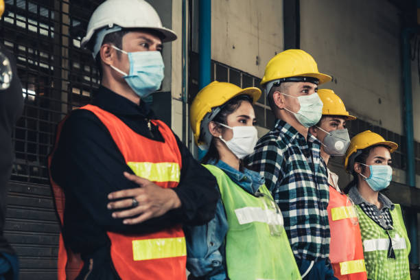 istock Workers with face mask protect from outbreak of Corona Virus Disease 2019. 1215839702