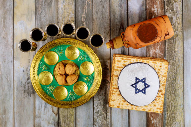istock Jewish Passover matzah, kiddush and seder with text in hebrew egg, bone, herbs, karpas, chazeret and charoset 1215842203