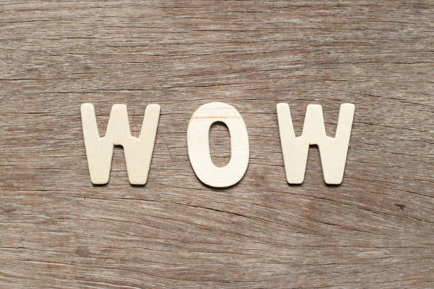 istock Alphabet letter in word wow on wood background 1215843020