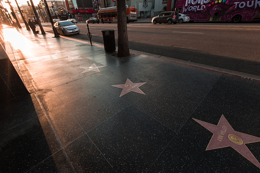 Hollywood California 3/18/2020: The city of Hollywood emptier than usual in March 2020. Hollywood Blvd showing the walk of fame stars, the Chinese theater and Dolby theater.