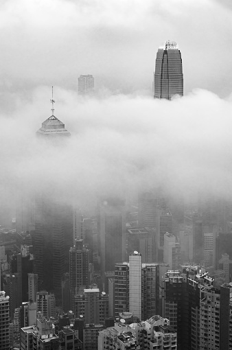 Skyscraper through the fog in Hong Kong city