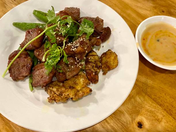 istock Vietnamese starter grilled goat meat with fermented tofu dipping sauce 1215849714