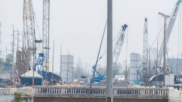 istock Background light pole with a large construction on the road surf 1215850573