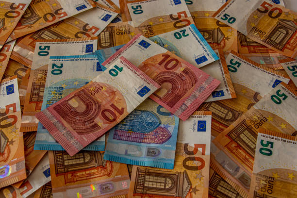 istock 10 and 20 euro notes with 50 notes in background 1215853801