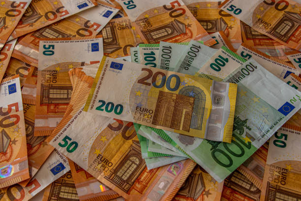 istock 200 euro note with bunch of 50 notes 1215853830