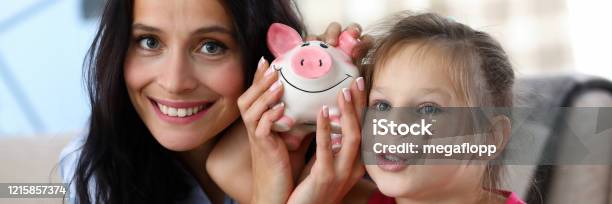 Cheerful Parent With Child Stock Photo - Download Image Now - Family, Savings, Economy