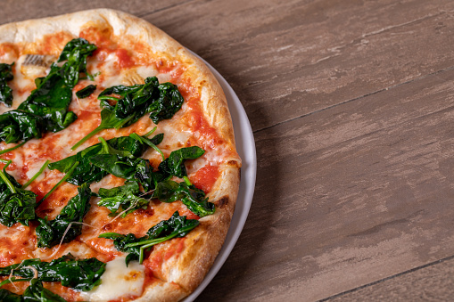 details of fresh tasty italian spinach pizza