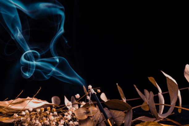 istock Stick holder and incense stick with leaves and flowers 1215859082