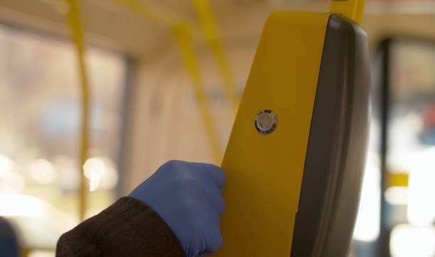 istock Hand in protective gloves paying in the bus 1215859994