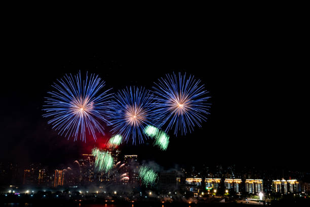 istock Modern city with fireworks at night 1215862163