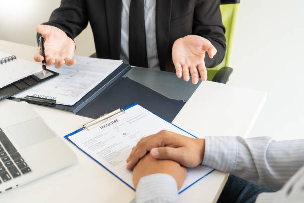 istock Job Interview and hiring concept, Appointment candidate Business man explaining about his profile and answer to Human resources manager sitting at a table opposite in the office 1215863166