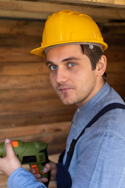 istock Handsome craftsman holding electric drill 1215864754