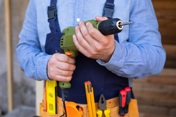 istock Electric drill in young man's hands 1215864941