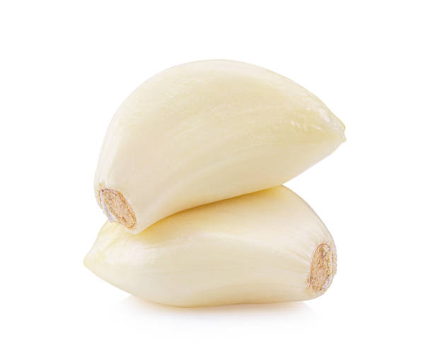 istock Garlic cloves on white background. full depth of field 1215865152
