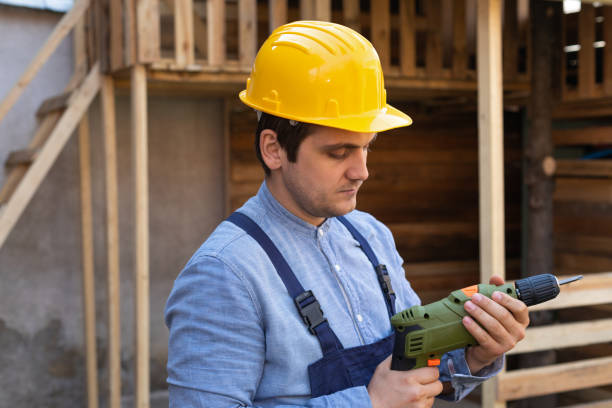 istock Handsome craftsman holding electric drill 1215865157