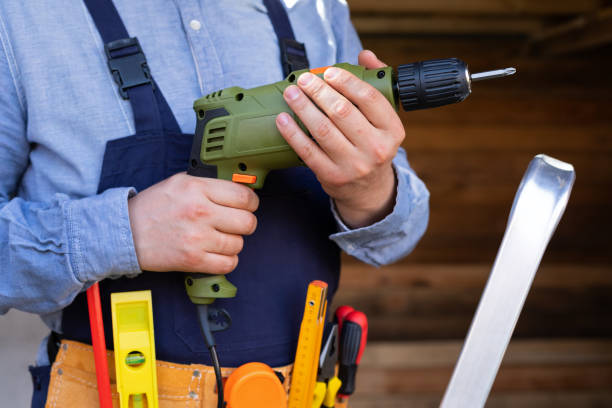 istock Electric drill in young man's hands 1215865213