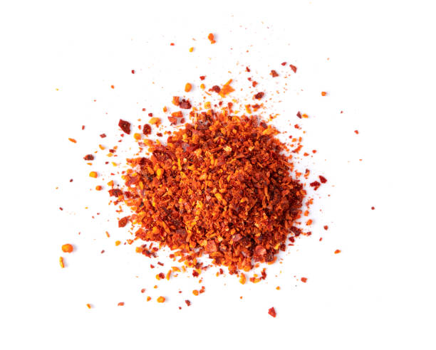 istock Crushed red chili pepper  on white background. top view 1215865301