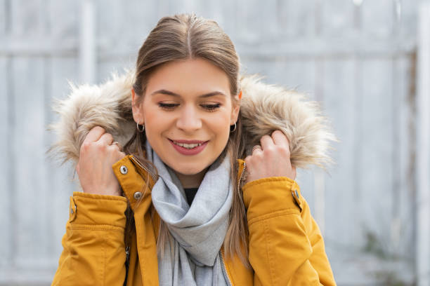 istock Attractive woman with yellow jacket 1215865981