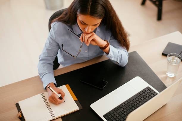 istock Businesswoman working on lap top in office. 1215866555
