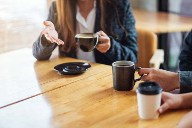 istock people enjoyed talking and drinking coffee together in cafe 1215867741