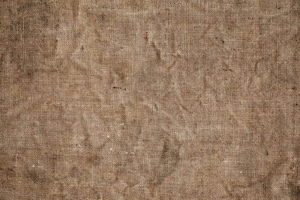 istock Light brown natural linen texture for the background. Close up 1215867772