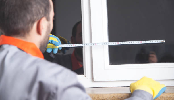 istock Man measuring window. Installing new window in house 1215867784