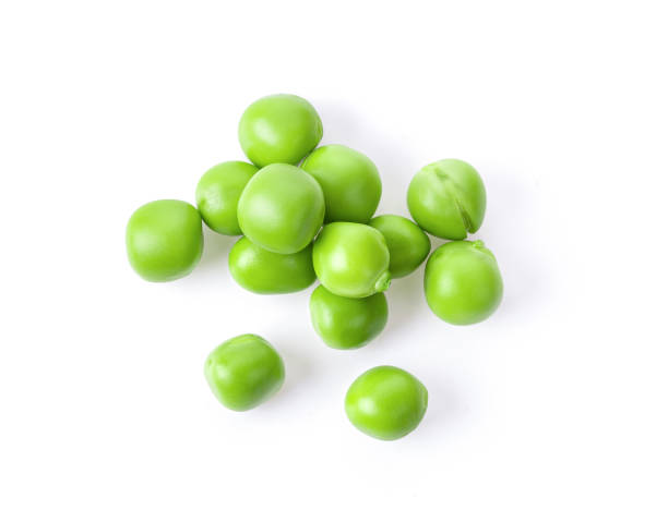 istock Green peas isolated on white background. top view 1215868671