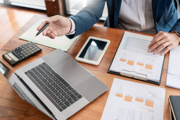 istock strategy analysis concept, Businessman working  financial Manager Researching Process accounting calculate analyse market graph data stock information review on the table in office 1215870018