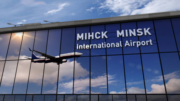 Airplane landing at Minsk mirrored in terminal Jet aircraft landing at Minsk, Belarus 3D rendering illustration. Arrival in the city with the glass airport terminal and reflection of the plane. Travel, business, tourism and transport concept. minsk stock pictures, royalty-free photos & images