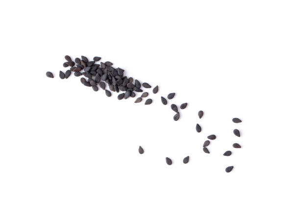 istock black sesame isolated on white background. top view 1215871329
