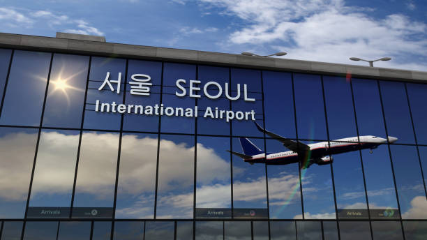 istock Airplane landing at Seoul mirrored in terminal 1215871417