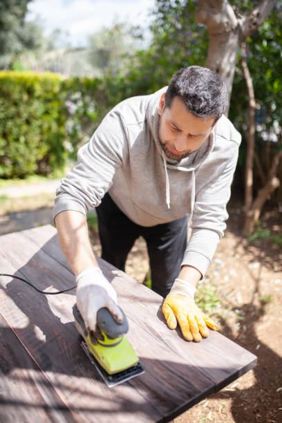 istock Man sanding wood furniture 1215871532