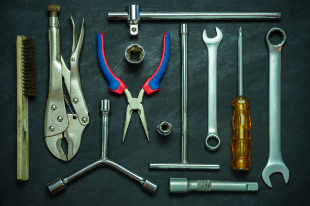 istock Set of many hand tools on cement floor. 1215871882