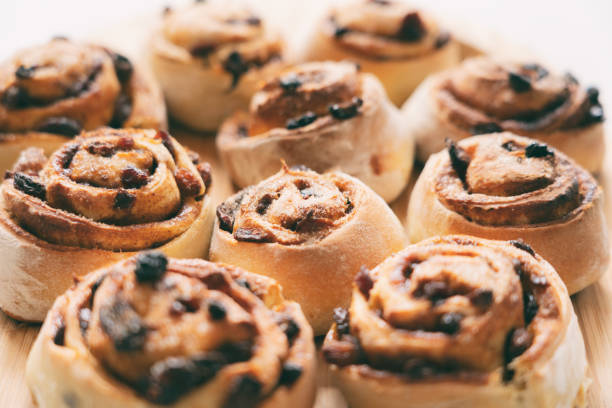 A batch of freshly-baked Chelsea Buns, straight from the oven.