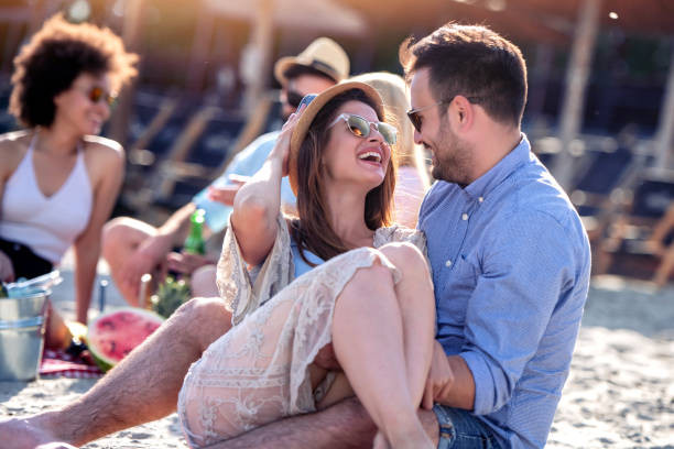 istock Friends having great time on the beach 1215873038
