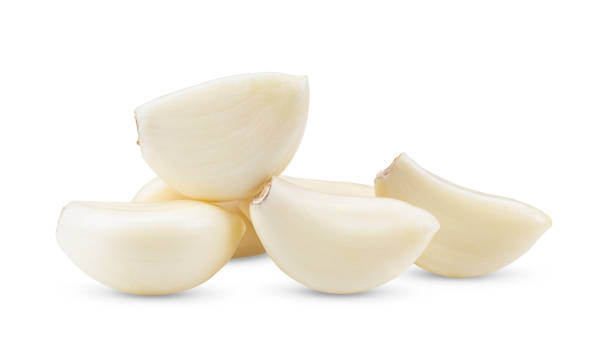 istock Garlic cloves on white background. full depth of field 1215873621