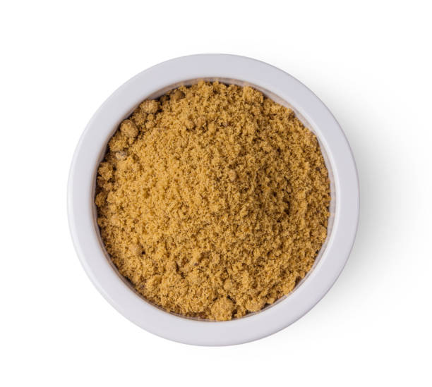 istock brown cane sugar pile in white bowl isolated on white background 1215874632