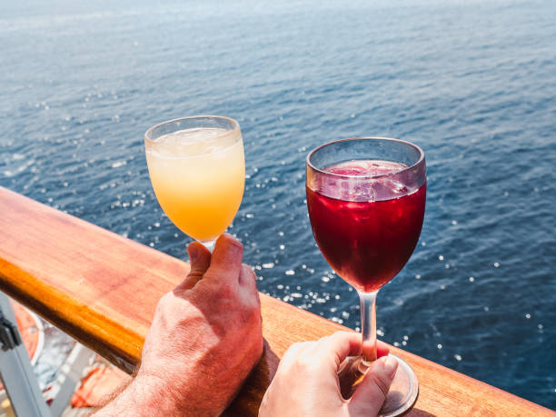 istock Two glasses with wine in the hands 1215879291